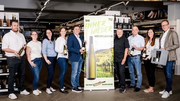 Teamfoto von 9 Personen